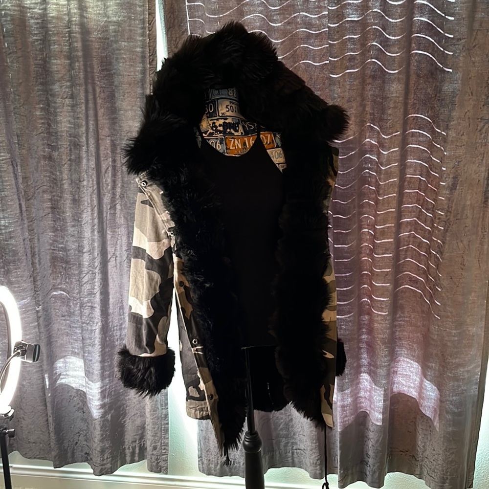 Camo print faux fur coat. faux fur in lining, hood, sleeves